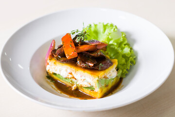 Causa accompanied by lomo saltado
