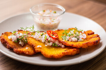Corn crepes, served with onion sarsa with spicy juice.
