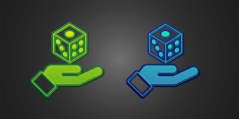 Green and blue Game dice icon isolated on black background. Casino gambling. Vector