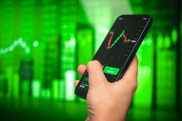 Mobile stock trading app. Financial stock chart graphs on background. Concept of mobile business, digital forex trade photo