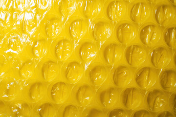 Yellow bubble wrap plastic material - packing supplies for diverse household and industrial needs