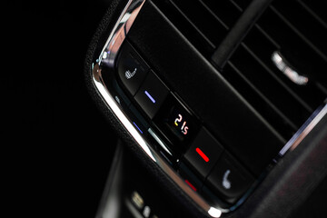 Fototapeta na wymiar Digital control panel car air conditioner dashboard. Modern car interior conditioning buttons inside a car close up view.