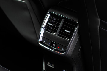 Digital control panel car air conditioner dashboard. Modern car interior conditioning buttons inside a car close up view.