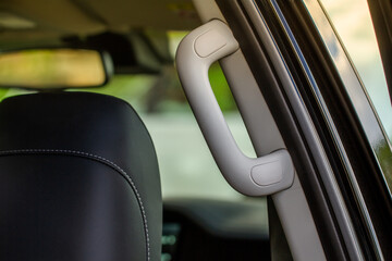 Modern Car Grab Handles, car interior details. Car grab handler for the passenger. Car ceiling...