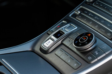 Modern car automatic gearbox. Gearbox control buttons. Gear selector close up.