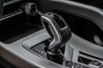 Modern automatic gearbox. Close up of the gearbox transmission handle. Automatic gear stick.