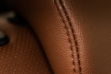 High angle view of modern car fabric seats. Close-up car seat texture and interior details. Detailed image of a car pleats stitch work.