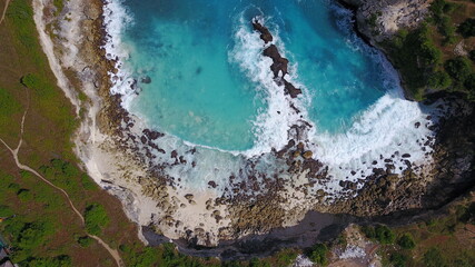 drone blue lagoon each sea aerial scene rocks waves nature explore adventure Nusa Penida island Bali Indonesia 