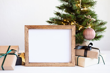 Christmas background empty wooden picture frame mock up and decoration. Winter holidays celebration...