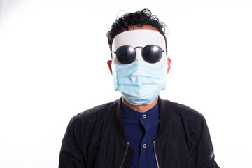 Man in disguise without expression and with face mask of a doctor. White background. Wearing sunglasses.