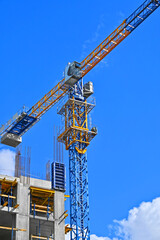 Crane and highrise construction site
