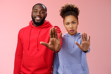 Friend asking stop worrying health raise palm forbidden enough dangerous gesture. Two african american man woman show hand prohibition taboo gesture persuading quit smoking, pink background - obrazy, fototapety, plakaty