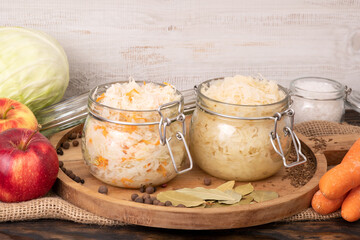 Sauerkraut, fermented cabbage in jars, healthy probiotic food - obrazy, fototapety, plakaty