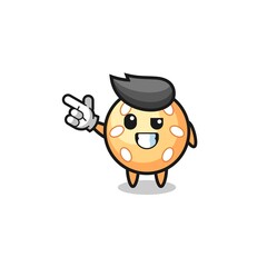 Obraz premium sesame ball mascot pointing top left