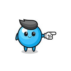 gum ball mascot with pointing right gesture
