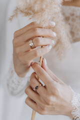 close-up of bride's hand with dried flowers