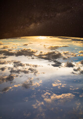 Photo montage of sky with clouds and Milky Way.