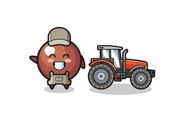 the chocolate ball farmer mascot standing beside a tractor