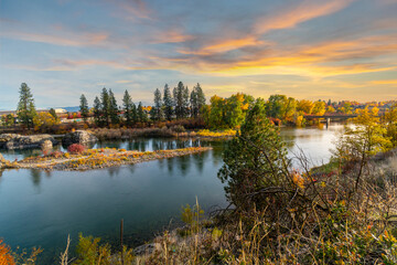 Sunset and a colorful sky above the Spokane River at Islands Trail Head park along the Centennial...