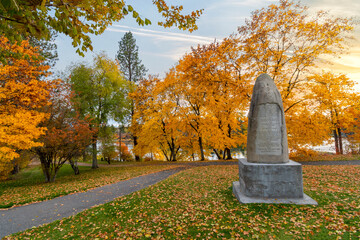 Late afternoon at Plantes Ferry park along the Spokane River with the monument to early settlers in...