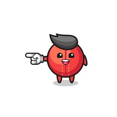 cricket ball cartoon with pointing left gesture
