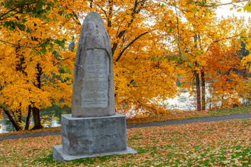 Late afternoon at Plantes Ferry park along the Spokane River with the monument to early settlers in...
