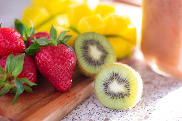 Closeup mango kiwi and strawberry on the table sweet tasty fruits healthy diet organic freshness...