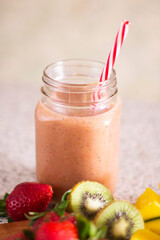 Closeup glass of fruit smoothie with strawberry kiwi mango fruits sugar sweet diet organic morning freshness drinks cocktail vitamin raw beverage