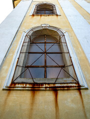 Old yellow framed church windows in Klatovy, Czech Republic