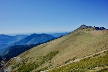 Naklejka premium Beautiful landscapes of mountain ranges of the Caucasus Mountains in the Krasnaya Polyana region of Sochi, Russia