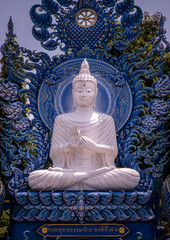 Chiang Rai, Thailand - Sep 05, 2020 : Beautiful Sculpture of white Buddha image at Wat Rong Suea Ten Temple, also known as the Blue Temple, locate at Chiang Rai province, northern part of Thailand. Se