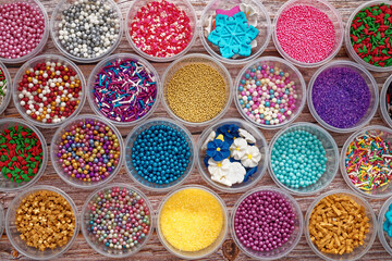 Colorful background. Edible pearls, grains and dragees, very colorful.