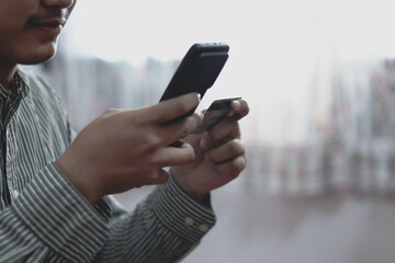 Close up man purchusing or paying domestic bills online by credit card, using laptop, young man customer making secure internet payment.