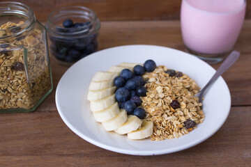 plate with muesli, blueberries and banana - top