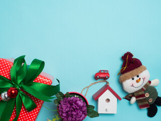 Christmas decoration cute object with wood  or colour background . Christmas color decorations, fir tree branches on red background. Flat lay, top view, copy space.