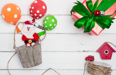 Christmas decoration cute object with wood  or colour background . Christmas color decorations, fir tree branches on red background. Flat lay, top view, copy space.