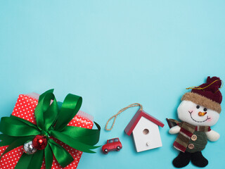 Christmas decoration cute object with wood  or colour background . Christmas color decorations, fir tree branches on red background. Flat lay, top view, copy space.