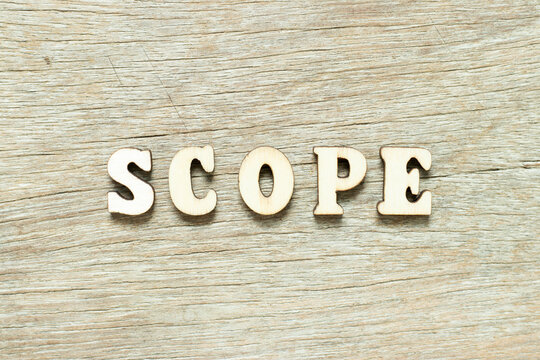 Alphabet letter in word scope on wood background