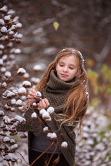 Fototapeta premium cute girl resting in nature on a winter day 