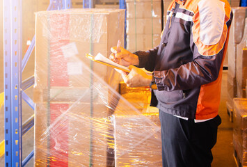 Warehouse Worker Holding Clipboard His Doing Inventory Management at Storage Warehouse. Check Stock...