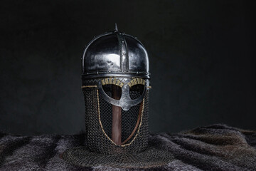 Isolated in dark background medieval knight helmet