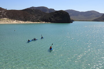 People canoeing on the ocean at Balandra, La paz Mexico