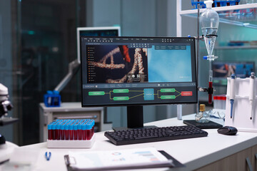 Fototapeta premium Nobody in scientific laboratory with research equipment at clinic. Empty microbiology cabinet for medical development designed with modern technology and blood vacutainers on desk