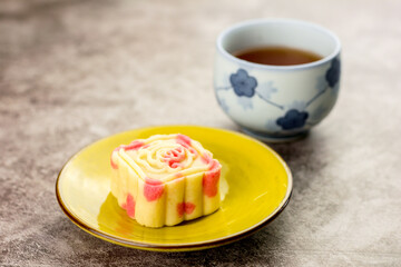 Close up, Homemade bakery concept. Delicious pineapple cookies look like mooncake on yellow plate with copy space.