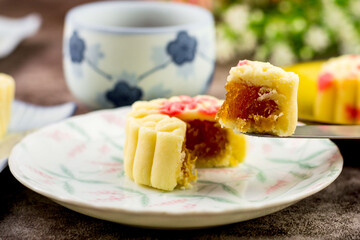 Close up, Homemade bakery concept. Delicious cutting pineapple cookies look like mooncake on white plate with copy space.