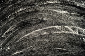 Flour or powder background on black background with whimsical abstract lines and stripes