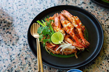 World famous freshly stir-fried cooked, Thai recipe of Prawn Pad Thai noodles