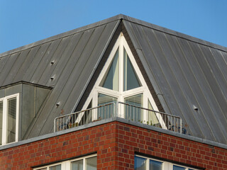 Triangle window on the top floor of building