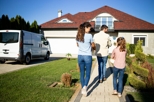 Happy Family Just Bought A New House And Moving In.