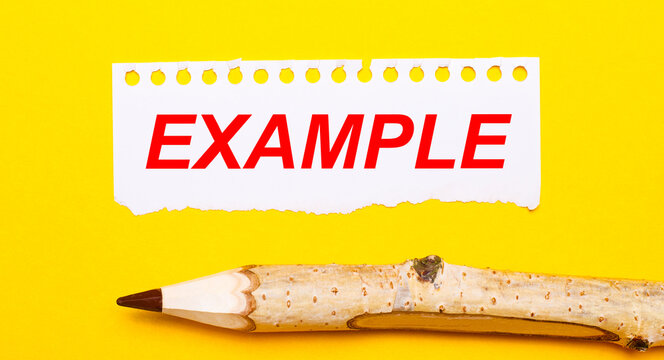 On a bright yellow background, a large wooden pencil and a sheet of torn paper with the text EXAMPLE